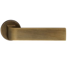 Дверная ручка Extreza Hi-tech SLIM SOUND (Саунд) 106 на круглой розетке R12 матовая бронза F03